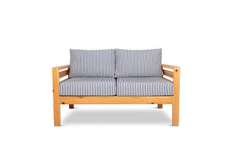 Classic outdoor two seater cedarwood couch with navy & white striped canvas cushions