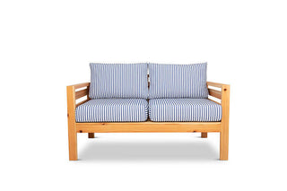 Classic outdoor two seater cedarwood couch with navy & white striped canvas cushions